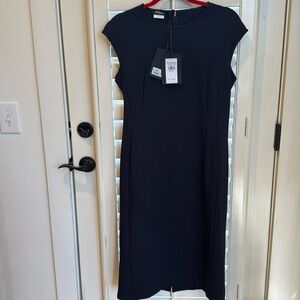 Beautiful navy dress by Les Copains. Short sleeve. Never worn and has tags.